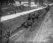 Canadian railway troops grading for light railway construction. July, 1917 July, 1917.