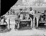 German Prisoners assembling captured guns, Camblain - l'Abbé. May 1917 May, 1917.
