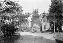 W.D. Scott's residence from gate June, 1910.