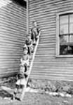 The Quartet - four boys on a ladder 1913.