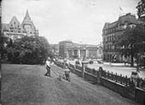 Wellington Street from East Lawn of Parliament Hill, showing old Post Office G.T.R. Station and Chateau Laurier n.d.