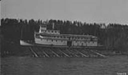 Steamer "Distributor" hauled out on the bank for the winter at Fort Smith, N.W.T., 1924