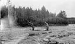 Poling up rapid, Montreal River, Sask. 1926
