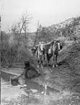 Getting water - Apache at the banks of the White River, Arizona 1907