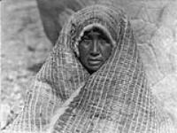 Nootka woman wearing cedar-bark blanket. [The Nootka inhabited west Vancouver Island, B.C.] 1916