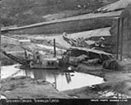 The Lewis River Company's dredge operating on Discovery claim, Bonanza Creek, Y.T., 1906 n.d.