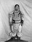 [Aivillik woman Nivisanaaq ("Shoofly Comer") in beaded amauti]. Original title: (A.P. Low Expedition, 1903-1904) Aivillik woman Nivisanaaq ("Shoofly Comer") in gala dress [between 1903-1904].