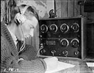 (Hudson Strait Expedition). Lieut. Wm. Laurie, R.C.C.S. at wireless radio, Base 'C' 1928