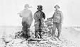Mr. Arthur English and two [Natives] at Ross Cairn, Aug. 1910 Aug. 1910