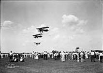 AW "Atlas" aircraft of the RCAF picking up messages during Air Force Day, Rockcliffe, Ontario, 14 July 1934 14 July 1934