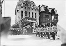 H.M. King George VI and Queen Elizabeth at the unveiling of the National War Memorial, showing buglers of the R.C.A.F. Brass Band in foreground 19 May 1939