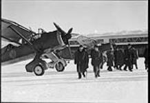 Rt. Hon. W.L. Mackenzie King (centre) inspecting Westland "Lysander" II aircraft of No. 110(AC) Squadron, R.C.A.F 26 Jan. 1940