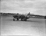 Pilots with Gloster 'Meteor' F.III aircraft EE311. (L-R): F/L Mackenzie, S./L Baudoux, F./L 6 Ot. 1945