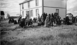 After the treaty dance.  Everything starts breaking up and people leave. Discussing it around the church 1937