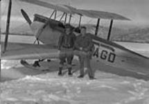 [de Havilland DH-60M 'Moth' aircraft CF-AGD at] Cominco Air School, Creston, B.C., 1930. Mike Finland [left] student, Page McPhee, instructor 1930