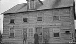 At the Mission Farm, R.W. Coutlee, Father Dupire, and J.A. McDougal 14 August 1925.