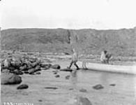 Portaging at the rapids on Amitookju River 15 September 1928.