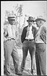 [L to R: C.H. Dickins, G.H. Finland, Mr. Buchanan (General Manager of Cominco, Trail, B.C.) on occasion of pouring the first gold brick at the Box Mine, Goldfields Sask. 1938.] 1938
