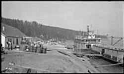 S.S. Distributor with barge being loaded at H.B. Co. warehouse June 1937.