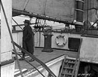 Dr. Johnson on the Bridge of C.G.S. "Arctic" 1924