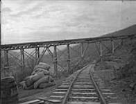 Bonanza Pipe crossing the tracks of the Klondike Mines Railway 1910