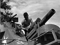 Bombardier B.W. Bailey in a Priest self-propelled gun of the 19th Field Regiment, Royal Canadian Artillery (R.C.A.), France, July 1944 July, 1944