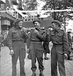 Soldiers eating ice-cream sandwiches, Antwerp, Belgium, 17 September 1944 September 17, 1944.