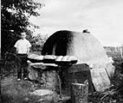 Outside baking oven of M. Kokolsky, Siftan District [Saskatchewan] 1910
