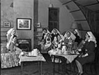 Nursing sisters having tea, No.8 Canadian General Hospital, Royal Canadian Army Medical Corps (R.C.A.M.C.), Aldershot, Hampshire, England, 24 November 1943 November 24, 1943.