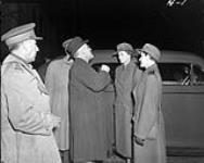 Col. The Hon. J.L. Ralston, Minister of National Defence, talking with Marion Jones and Marjorie Brown, the first recruits to wear the new uniform of the Canadian Women's Army Corps (C.W.A.C.), Ottawa, Ontario, Canada, 3 November 1941 November 3, 1941.