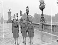 Personnel of the Canadian Women's Army Corps (C.W.A.C.) crossing the Alexandre III bridge, Paris, France, 15 October 1944 October 15, 1944.