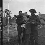 Personnel of the 7th Canadian Infantry Brigade with captured German uniform 09-Jul-44