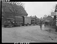 Canadian Army vehicles at the crossroads 9 Apr. 1945
