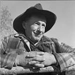 Floyd ("Panhandle" because he was once a cowboy in Texas) Phillips, owner of Home Ranch, 200 miles east of Quesnel, B.C., beyond the Itcha Mountains north of Anahim Lake, B.C. His story was told in Grass Beyond the Mountains by Rich Hobson Oct. 1956