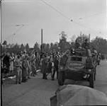 Dutch civilians lining road along which passed Canadian Army vehicles during Liberation 7 May 1945