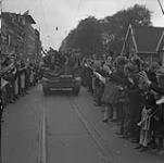 Dutch civilians line road along route of Canadian Army advance through Netherlands at Liberation 7 May 1945