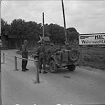 Entrance to the German garrison base, where German soldier and Canadian troops check and accept soldiers wishing to surrender 11 May 1945