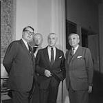 Montreal Museum of Fine Arts Director Dr. Evans H. Turner with new President A. Murray Vaughan and retiring president Col. H.M. Wallis at 103rd annual meeting 26 Sept. 1963.