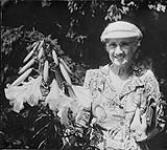 Isabella Preston with lilies c.a. 1956