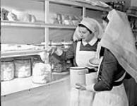 Nursing sisters dispensing medical supplies at the Royal Canadian Naval Hospital, St. John's, Newfoundland, ca. 1942 [ca. 1942]