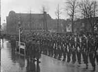 March-past with Brigadier I.S. Johnson taking salute, Remembrance Day ceremony. Groningen, Netherlands, 10 Nov. 1945 10 NOV. 1945