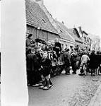 Personnel of the 14th Canadian Hussars meeting Dutch children during the liberation of Oostkerke, Netherlands, 1 November 1944 November 1, 1944.