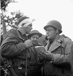 War correspondent Charles Lynch talking to Rifleman Albert Jesson during the attack on the German airport at Carpiquette 04-Jul-44