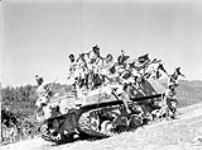 Infantrymen of the 1st Battalion, 5th Mahratta Regiment jumping from a Sherman tank of the Calgary Regiment during a tank-infantry training course, Florence, Italy, 28 August 1944 August 28, 1944.