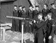 Defensively Equipped Merchant Ships (DEMS) gunners learning to fire a Lewis machine gun, Esquimalt, British Columbia, Canada, 15 March 1944 Marh 15, 1944.