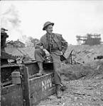 Lieutenant H. Gordon Aikman of the Canadian Army Film and Photo Unit, Colombelles, France, 19 July 1944 July 19, 1944.