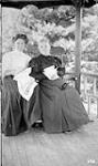 Two unidentified women on verandah ca. 1907