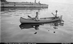 Two unidentified men in a canoe, Rosseau Lake, Muskoka Lakes ca. 1907