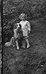 Mr. & Mrs. Lloyd Dawson's child & dog, Rossmoyne, Rosseau Lake, Muskoka Lakes ca. 1907