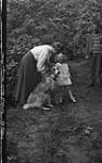 Mr. & Mrs. Lloyd Dawson, child & dog, Rossmoyne, Rosseau Lake,Muskoka Lakes ca. 1907
